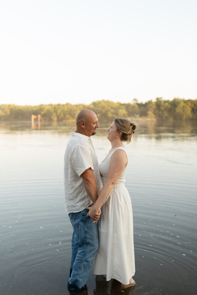 Couple standing in the water at Wildcat Bluff Recreation Area in Vinton, IA.