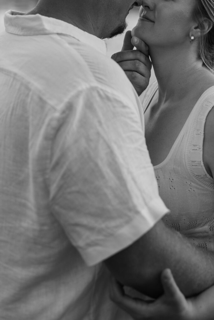 Black and white photos of a couple with arms wrapped around each other at Wildcat Bluff Recreation Area in Vinton, IA.