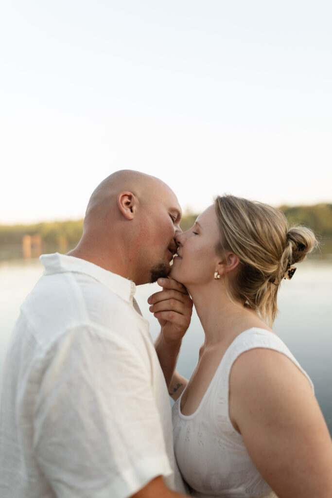 Couple almost kissing at Wildcat Bluff Recreation Area in Vinton, IA.