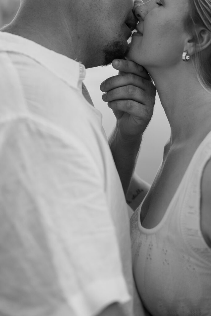 Couple almost kissing at Wildcat Bluff Recreation Area in Vinton, IA.