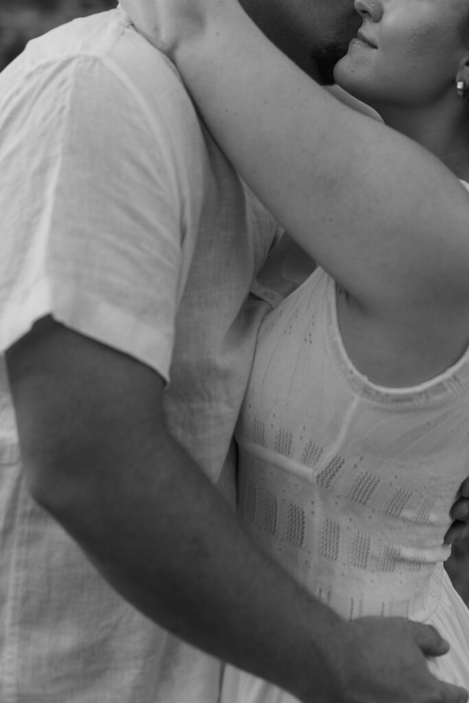 Black and white photo of couple during an engagement session at Wildcat Bluff Recreation Area in Vinton, IA.
